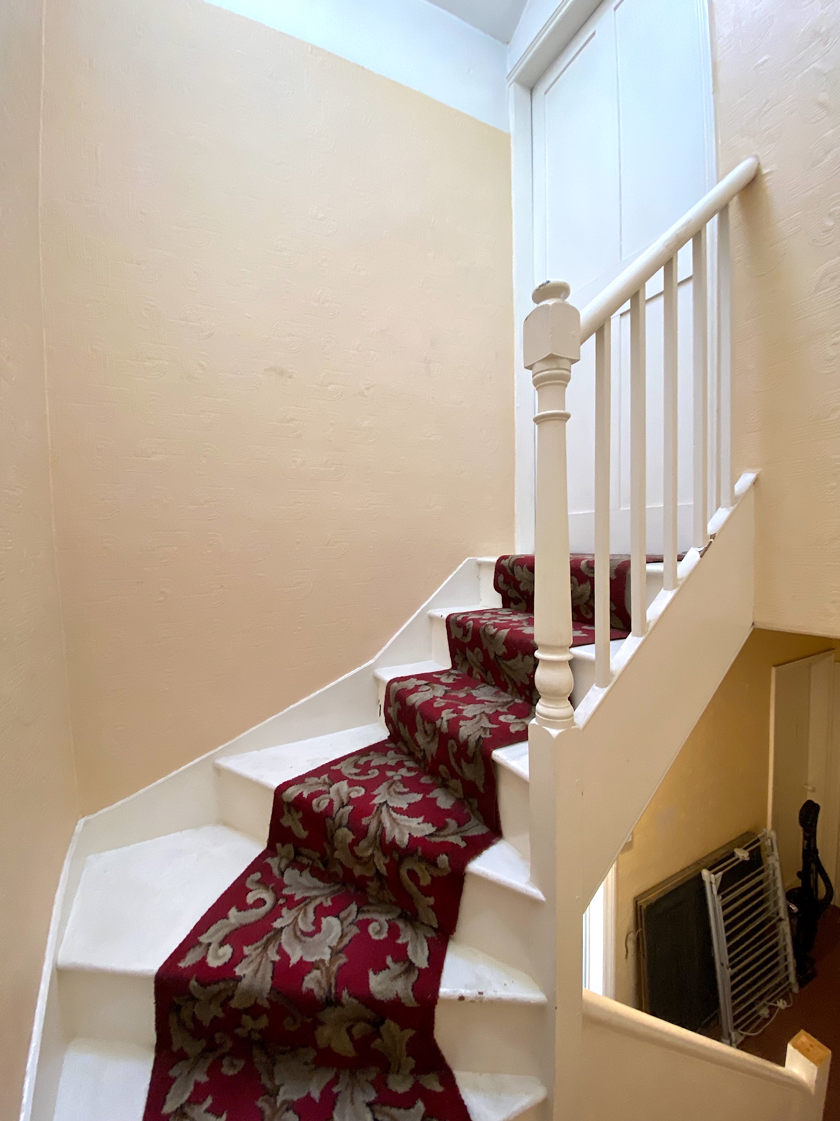 victorian attic stairs with runner