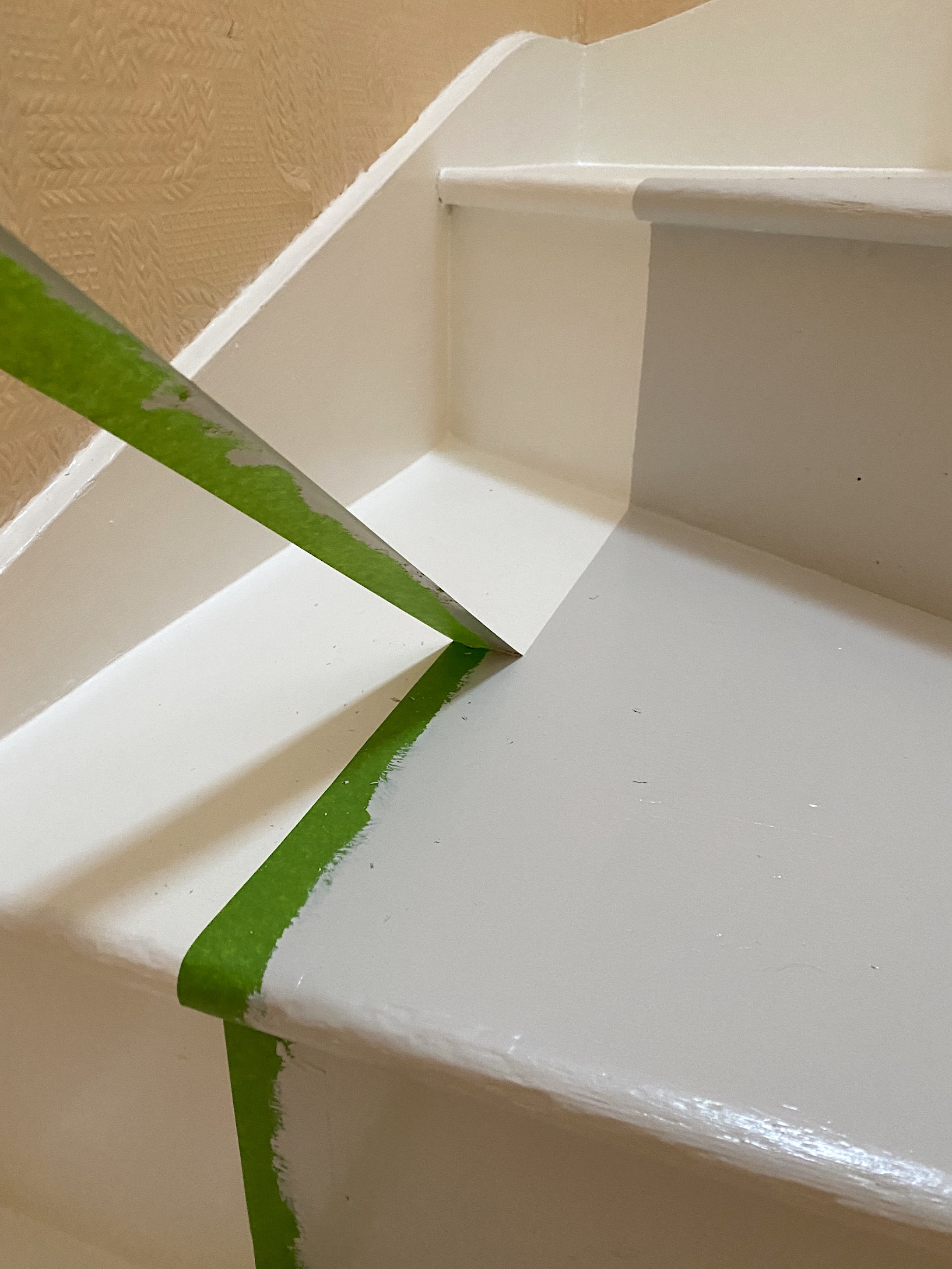 removing masking tape on stairs